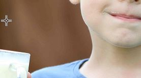 child with glass of yogurt